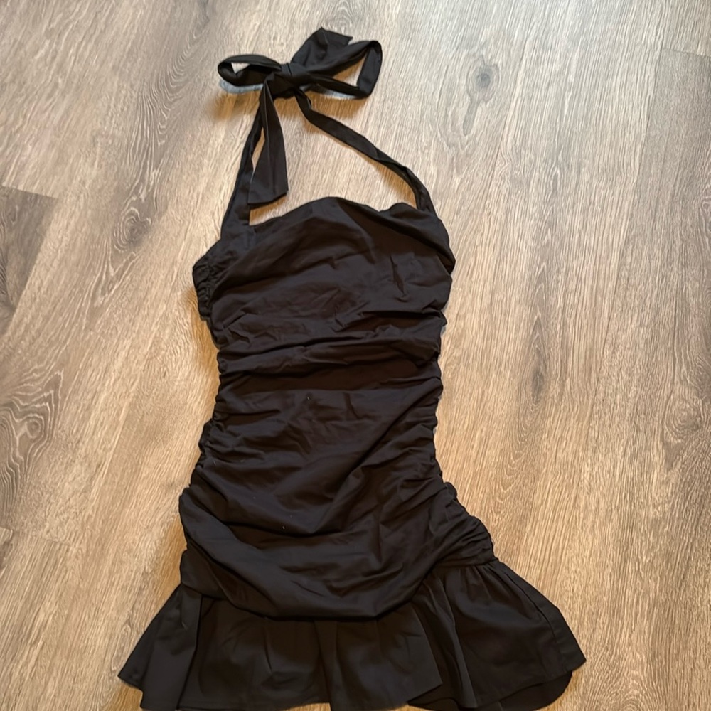 Black strapless minidress with tie.